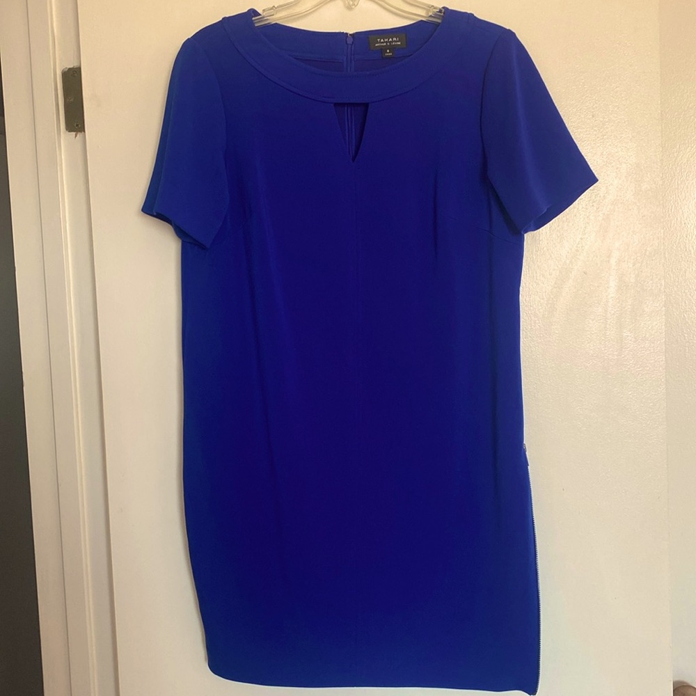 Beautiful blue Tahari dress.Zipper on the side and back. Perfect condition